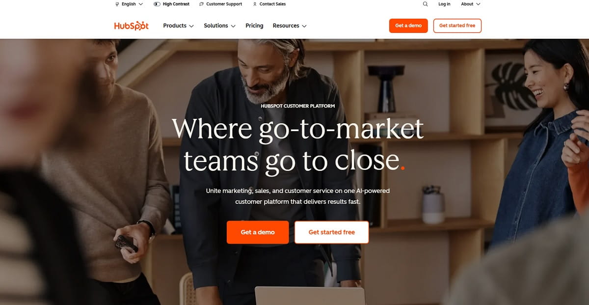 HubSpot contact analytics showing website visits, form submissions, and revenue attribution
